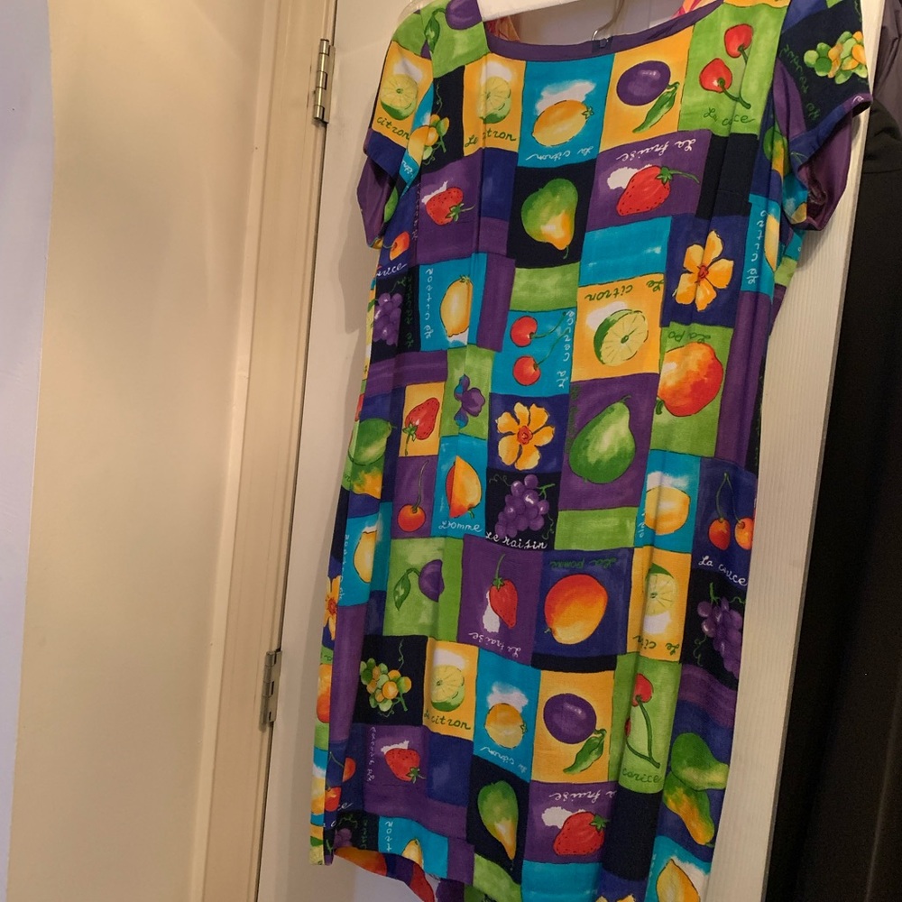 Navy short-sleeve scoop neck dress with polyester lining and fruit designs.